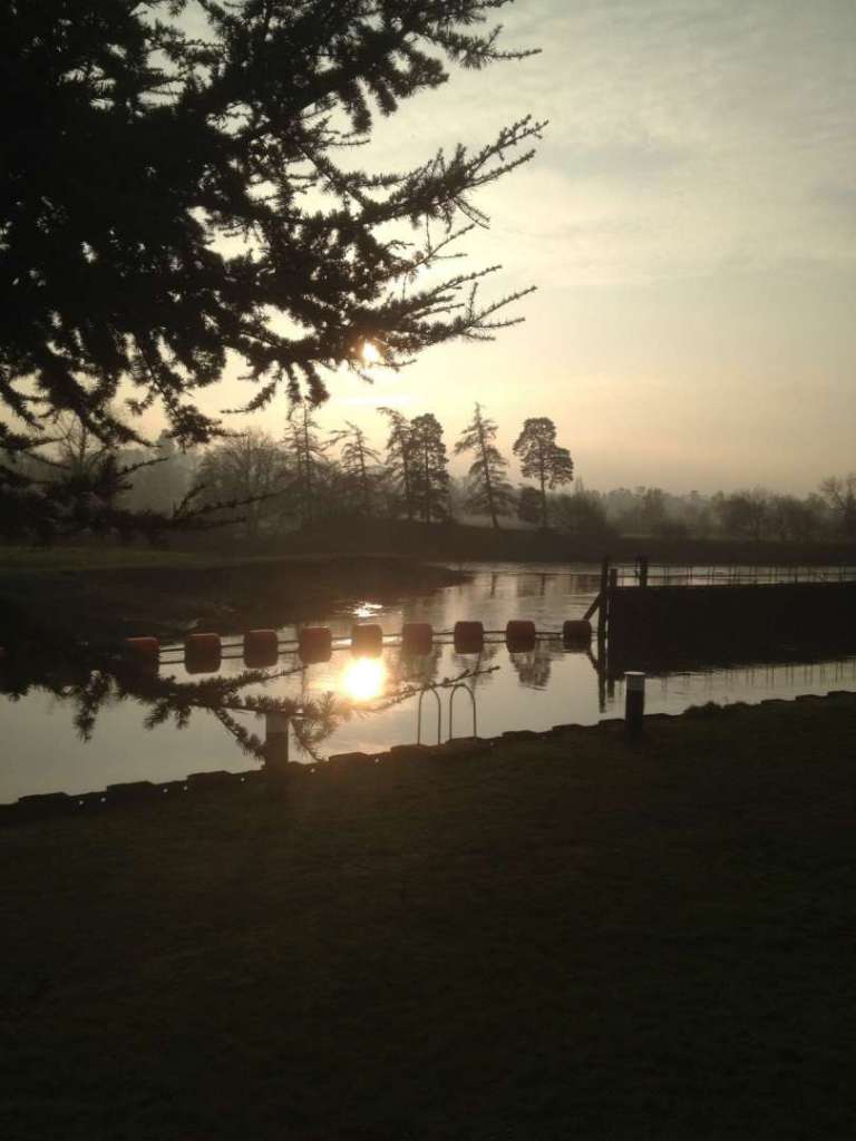 The sun rising over the River Severn Fish Pass and Grimley village